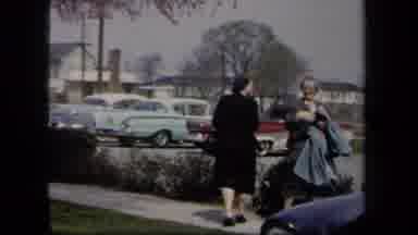 New York USA (1958): Six Women With Coats In Parking Lot On Windy Day