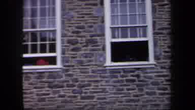 New York USA (1958): Old Ladies Standing In Front Of A Old Stone House With The