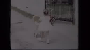 New York USA (1958): Two Boys Play In The Street While A Little Girl Walks With A