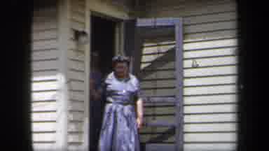 New York USA (1958): Many Women Coming Out Of A House To Greet People Visiting
