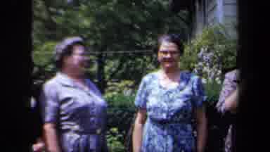 New York USA (1958): Group Of Older Ladies In Dresses With One Coughing And