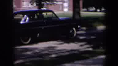New York USA (1958): Two Women Wave Goodbye To A Passing Driver In A Cool Car