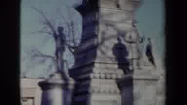 New York USA (1959): People Standing In Front Of Stone Statue In The Middle Of The