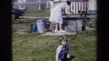 New York USA-1959: Mother and Child in Suburban Backyard with Classic Cars