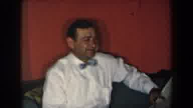 New York USA (1959): Happy Man Reads The Newspaper While Sitting Next To A Lovely