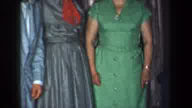 New York USA (1959): A Man And Two Women Standing Next To Each Other And Wearing
