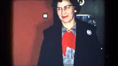 New York USA (1959): Woman With Dress And Nice Red Scarf Walking Out Of Her Small