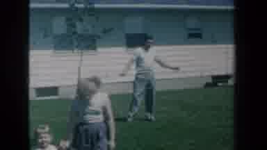 New York USA (1959): During A Family Picnic Mom Relaxes On Lawn Lounger While Her