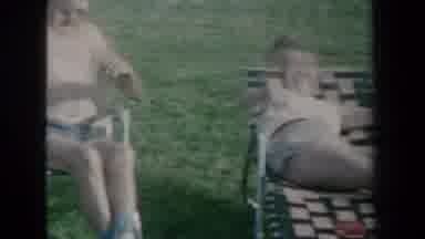 New York USA-1959: Three Friends Relaxing And Laughing On Lawn