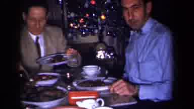 New York USA (1959): Group Of People Enjoying A Meal Together Finely Dressed