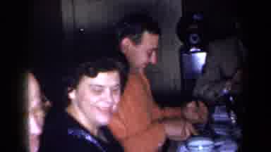 New York USA (1959): Family Enjoying A Meal Sitting Around Dinner Table And