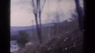 New York USA (1959): Jerky Movement Down A Wooded Hill Toward A White House With