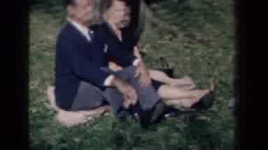 New York USA (1959): Female Friend Sitting Beside A Couple In A Park On A Blanket