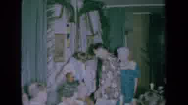 California USA (1961): Woman Takes Off Hawaiian Lei And Presents It To Man