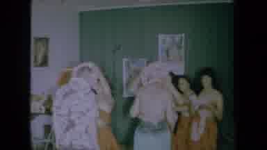 California USA (1961): Four Hawaiian Girls Welcoming A Man And A Woman By Putting