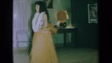 California USA (1961): Woman With Black Hair Dancing The Hula In An Hawaiian Style