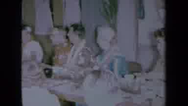 California USA (1961): A Group Of Old People Sitting Around A Table Talking To
