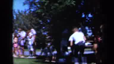 California USA (1961): Boy Picks Object Up While Other Kids Are In Line