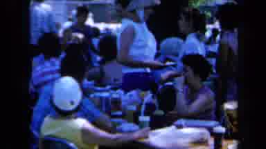 California USA (1961): A Group Of Family Members Having A Good Time At A Big