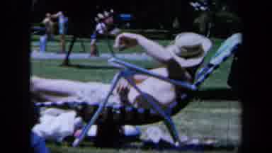 California USA (1961): A Family Passing And Biding Their Time At A Park While The