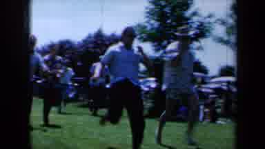 California USA (1961): Grown Men Competing In Athletic Events With Other Challenge