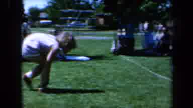 California USA (1961): Children Crossing The Finish Line In A Race With Hands On