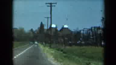 California USA (1969): Scenic Lakeview From A Vehicle In Motion On A Two-Lane Road