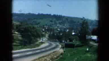 California USA (1969): Country Road Passing Through Rolling Hills In Village