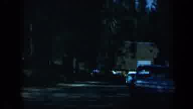 California USA (1969): Man Drives Past Cars In The 1960'S