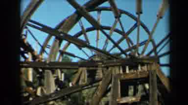 California USA (1969): Old Bridge With Spoke Wheels Covering It And A Blue Sky