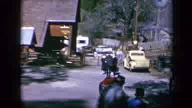 California USA (1969): Busy Street In Mountain Region Town With People Headed To