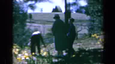 California USA (1969): An Old Video Of A Family Walking Through A Garden And Then