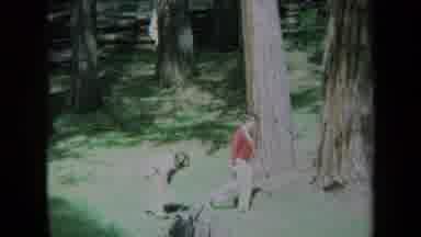 California USA (1969): Two Kids Playing In The Park And Busy Traffic Scene