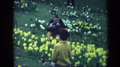 California USA (1969): People Observing Flowers On A Spring Day And Running And