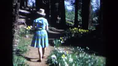 California USA (1969): A Woman Walking And Kids Playing In A Field