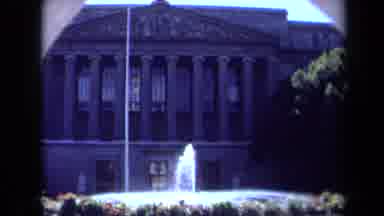California USA (1969): Zooming On A Fountain In Front Of A Building With Columns