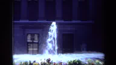 California USA (1969): A Water Display Is On And Surrounded By Flowers On A Sunny
