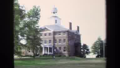 Annapolis USA (1970): A Beautiful Building Surrounded By Grass And Trees Looking