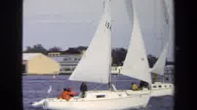Annapolis USA (1970): A White Sail Boat Being Blown By The Wind Out To Sea