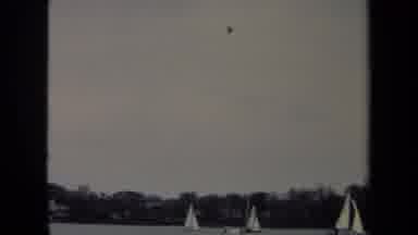 Annapolis USA (1970): Many Sailboats Crossing A Body Of Water With The Camera