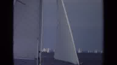 Annapolis USA (1970): View From Sailboat Of Multiple Sailboats Moving Slowly On