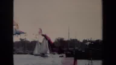 Annapolis USA (1970): Two White Sailboats Roaming Water In A Harbor With Other