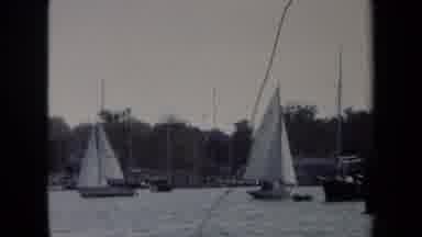 Annapolis USA (1970): Sail Boats Going Back In Forth In The Water When The Sun Is