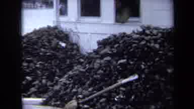 Annapolis USA (1970): Two Huge Piles Of Wood Stacked Up Outside Of House Then A