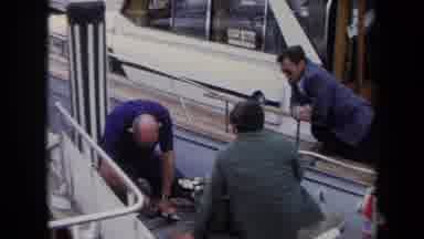 Annapolis USA (1970): A Dock Full Of Many Boats With People On Them