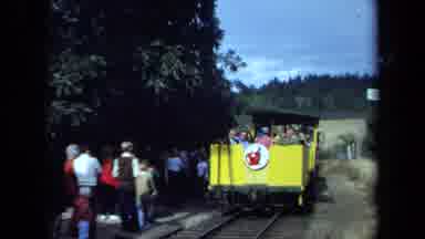 California USA (1970): People Aboard Yellow Train With Apple And Worm Logo Look