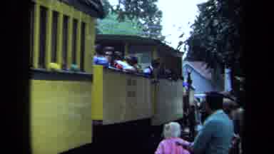 California USA (1970): A Girl And Man Beside And Then On A Yellow Train