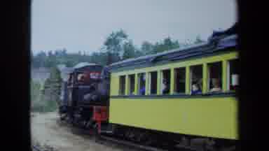 California USA (1970): Tourists On Small Steam Train Ride In The Country With Two