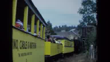 California USA (1970): Conductor And Tourists Riding A Camino Yellow Train Through