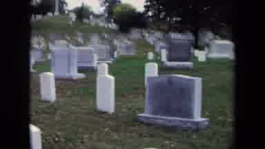 WASHINGTON DC USA-1970: Camera Pans Over A Cemetery And Zooms In On A Specific Gravestone